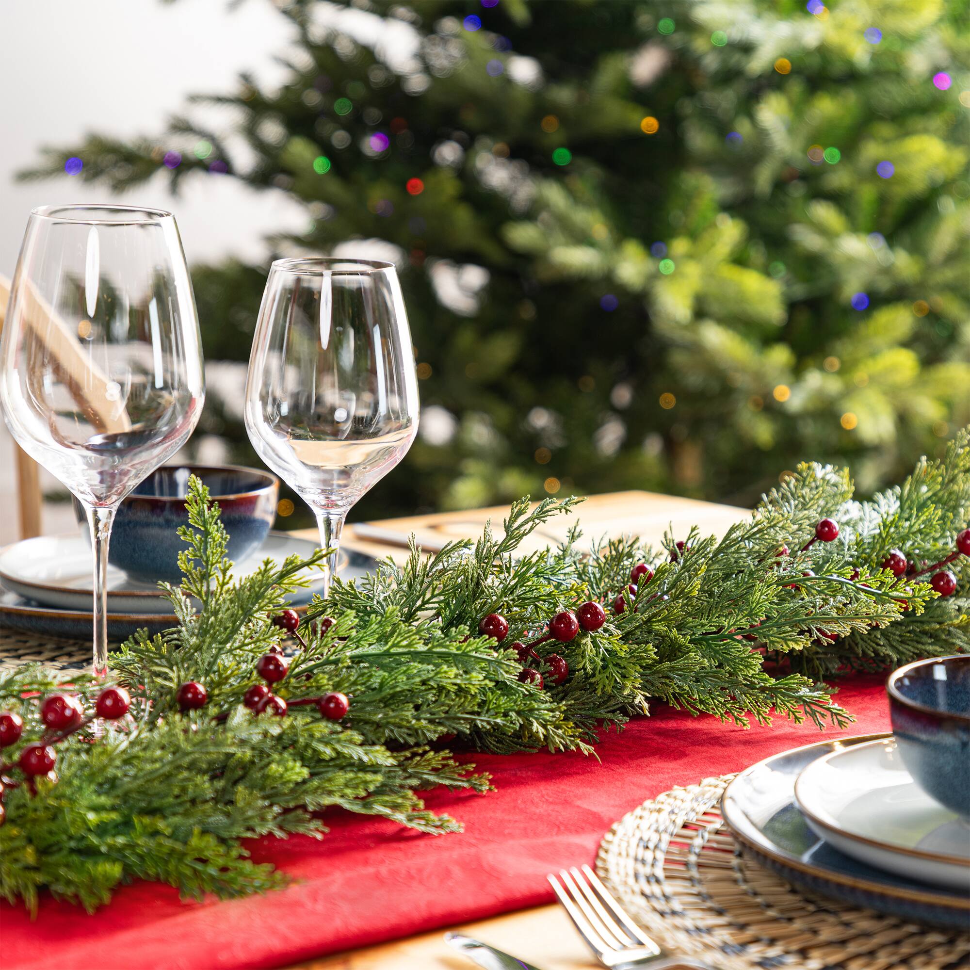 Glitzhome® 9ft Christmas Greenery PE Cedar Garland with Red Berries